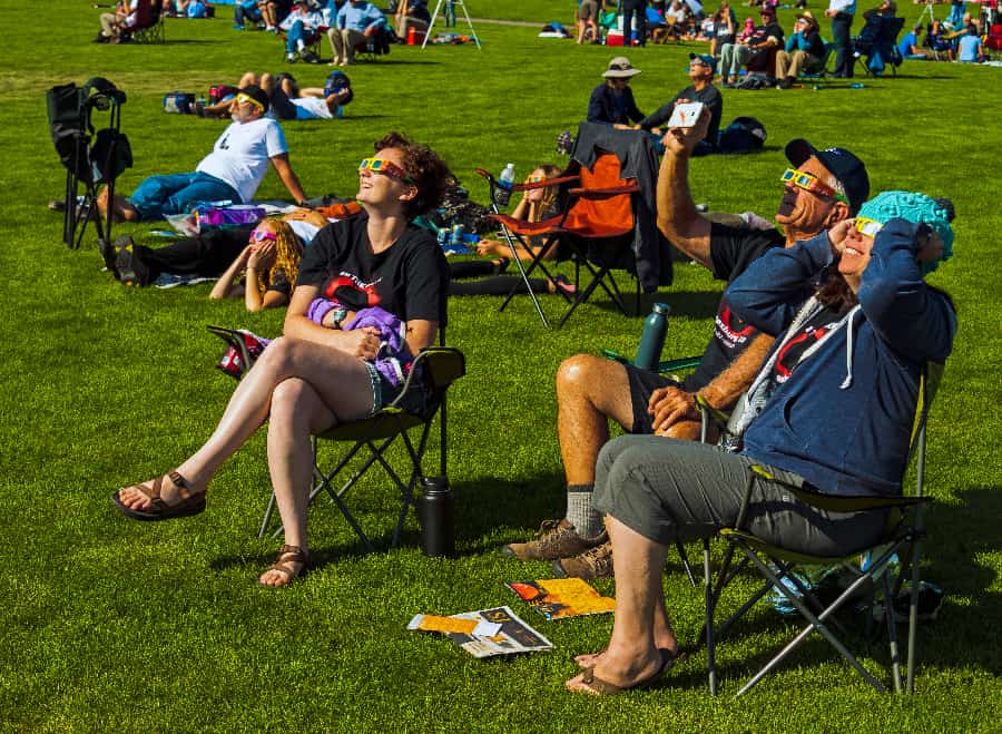 People watching the early phase of the 2017 solar eclipse in Riverside Park, Rexburg, Idaho.