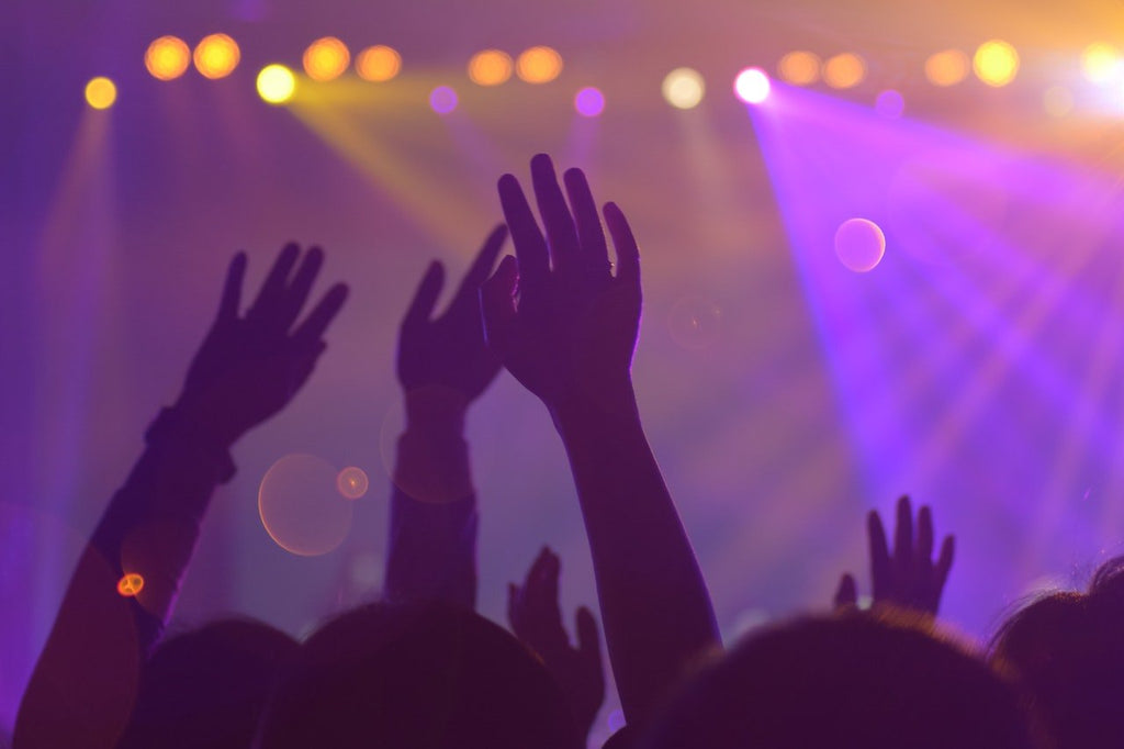 A group of people dancing at a rave