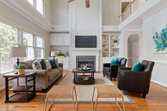 A living room with colorful pillows and artwork