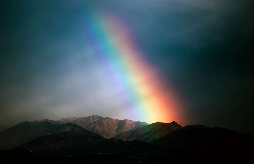 A rainbow over a mountain range