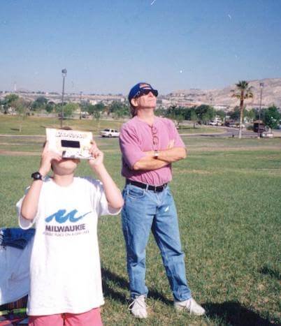 Rainbow Symphony founder Mark and his son watching an eclipse in the 1980s